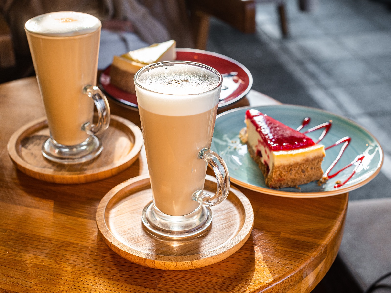 Classic New York Cheesecake And Coffee Latte on a table in cafe. Top view